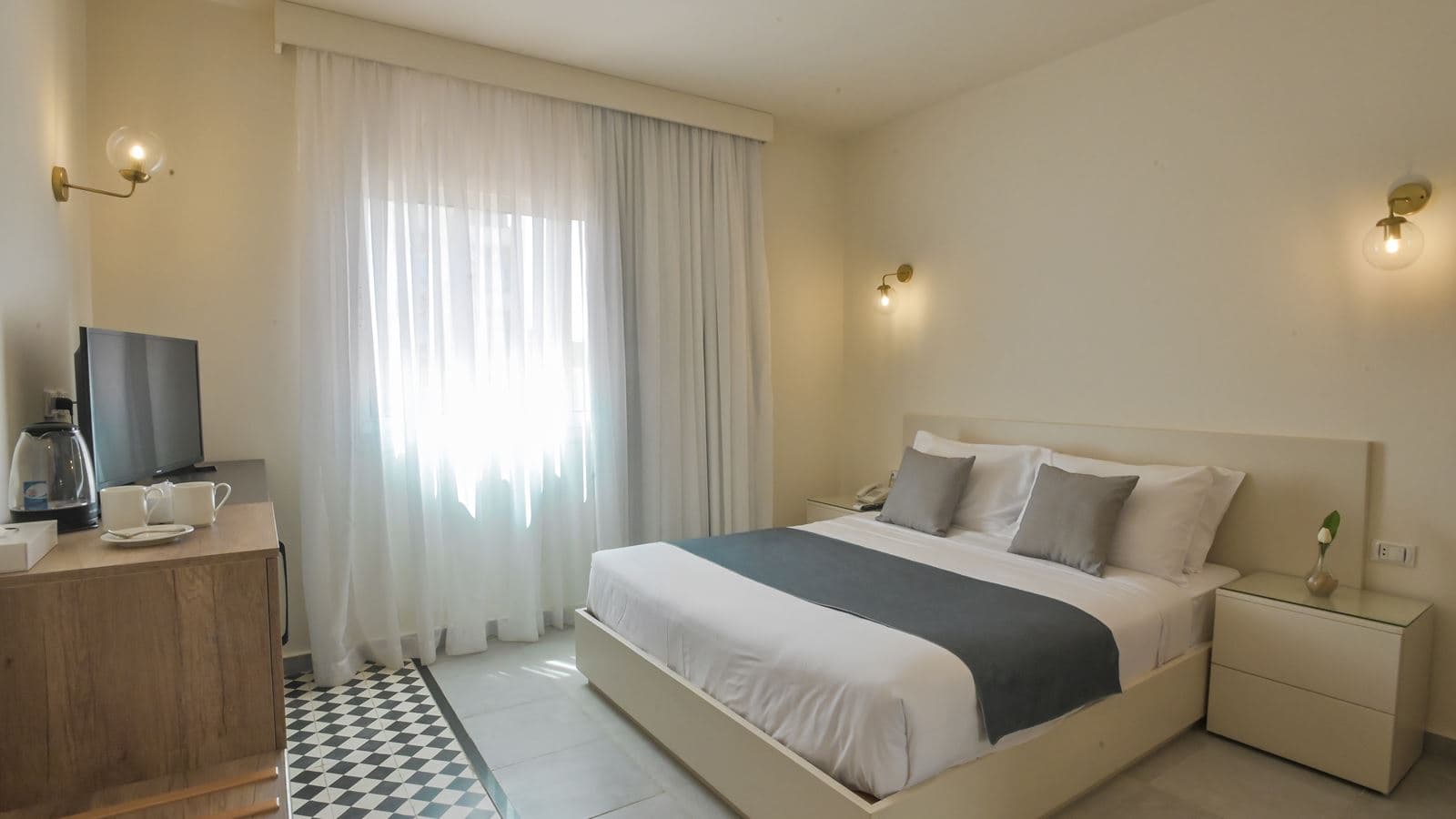 rooms-standard-room-back-view-bedroom-with-queen-size-bed-bathroom-with-shower-window