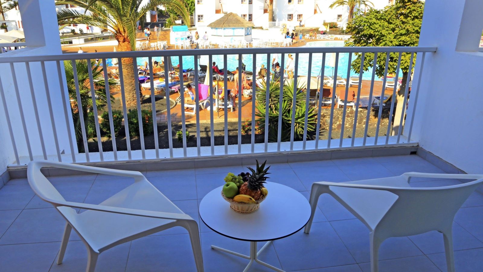 rooms-deluxe-room-pool-view-balcony-or-terrace